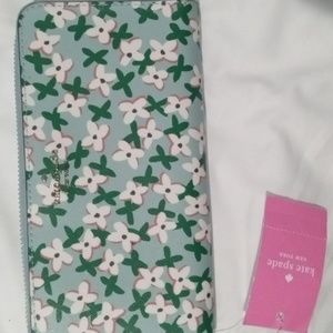 Kate Spade Floral Pop Prin wallet Light Blue and Green in color